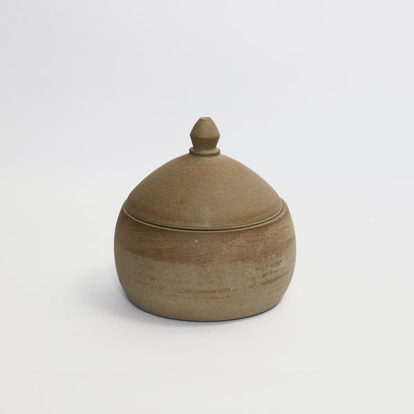 Curved, lidded pot, toasted stoneware clay. Unglazed exterior with charcoal, black glaze inside. Lid on in photograph.